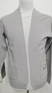 Detail of light grey knit cardigan with V-neck, ribbed texture and side pockets