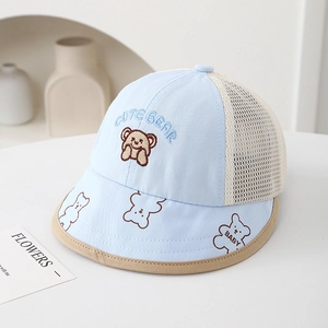 Detail of baby sun hat featuring cute bear embroidery and breathable mesh fabric