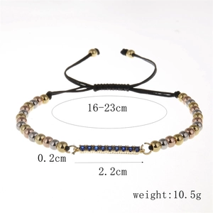 Adjustable Milan rope bracelet featuring multi-color gold beads and blue zircon bar detail