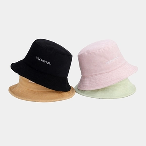 Pile of four colors of towel fabric bucket hats featuring mama embroidery detail