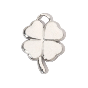 Macro view of a silver three-dimensional four-leaf clover pendant with a polished finish