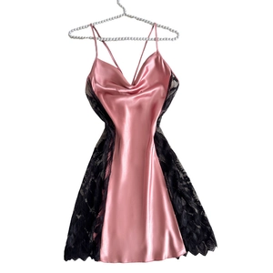 Pink satin slip nightgown with black lace trim and delicate spaghetti straps for women