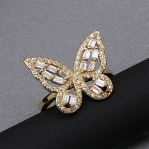 Detailed view of gold butterfly ring featuring micro-paved white cubic zirconia
