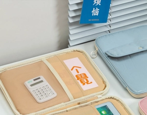 Internal layout of light blue laptop sleeve showing mesh pocket and stationery slots