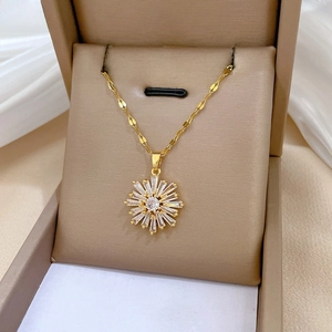 Detailed macro shot of sunflower pendant with baguette crystals in luxury jewelry box