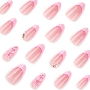 3D pink floral press-on nails with almond shape, pearl accents, and French tips on white background