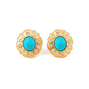 Vintage floral stud earrings with turquoise center stone and rhinestone halo on white background