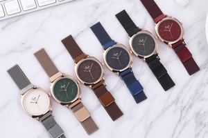 Detail of elegant ladies quartz watches with Milanese magnetic straps in multiple colors