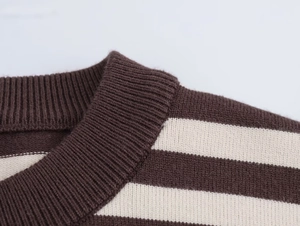 Close-up of ribbed crew neck and brown striped texture of knitted cardigan sweater