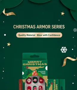Detailed view of Christmas themed press-on nails in festive green packaging box