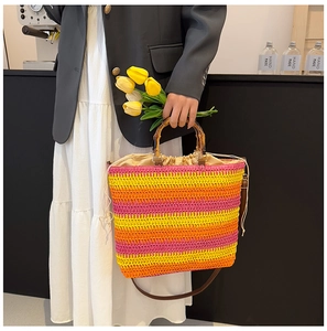 Detail of colorful striped woven tote bag with bamboo handle and drawstring closure