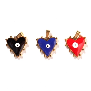Three gold stainless steel heart pendants with black blue and red evil eye enamel detail