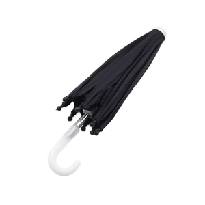 Folded black umbrella accessory for 18-inch dolls with white curved handle and metal tips