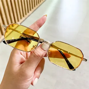 Retro octagonal gold metal sunglasses with yellow translucent lenses and slim frames