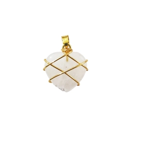 Close-up of heart-shaped white crystal pendant with intricate gold wire wrapping detail