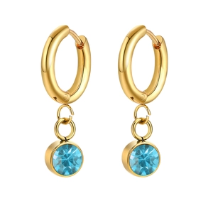 Close-up of gold stainless steel hoop earrings with round light blue zircon pendants