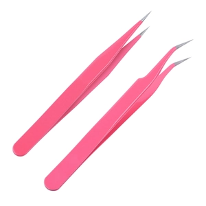 Macro shot of pink precision nail art tweezers with straight and curved pointed tips