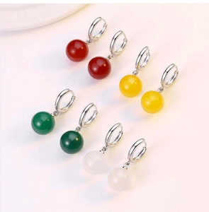 Detailed close-up of multi-colored natural agate bead earrings in four classic stone colors