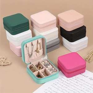 Portable leather jewelry box in various colors with a square zipper and mirror detail