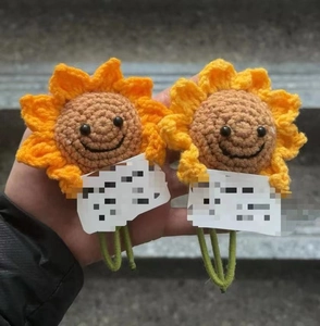 Detailed view of handmade crochet sunflower decoration with vibrant orange petals
