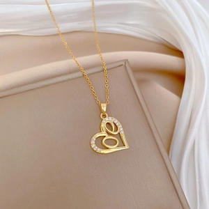 Elegant hollow heart necklace in gold with sparkling pave-set cubic zirconia on thin chain