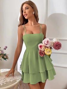 Detail of green tiered A-line dress with spaghetti straps and square neckline
