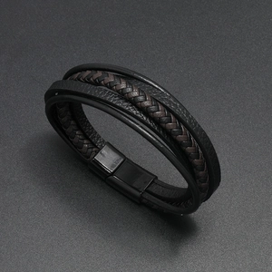 Macro view of multi-layer braided leather bracelet with black magnetic metal clasp