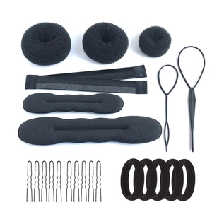 Detail of 24-piece black hair styling tool set with donut buns and pull-through needles