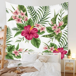 Close-up of tropical floral tapestry with hibiscus and palm leaves on a bedroom wall