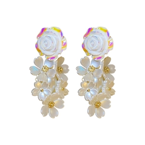 Elegant white floral drop earrings with holographic rose and delicate pearl fringe details
