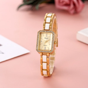 Elegant gold and white ceramic square watch with rhinestone bezel on a pink background