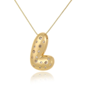 Detail view of gold-plated 3D letter L pendant with cubic zirconia on white background