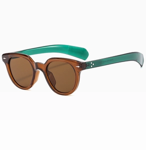 Detail of vintage leopard print sunglasses with star hinge and green inner temples