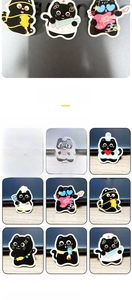 Macro view of twelve assorted cartoon black cat acrylic pins featuring various character designs