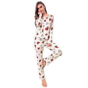 Women heart print long sleeve pajamas set in beige with red and black hearts