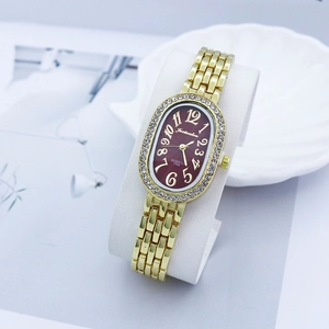 Elegant gold quartz watch for women with oval rhinestone bezel and burgundy red dial