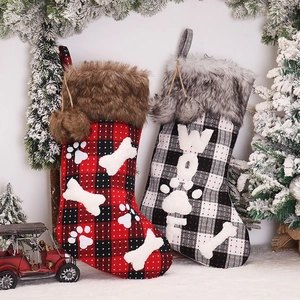Classic plaid Christmas stockings with faux fur cuff and bone patterns for festive decor