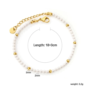 Stainless steel freshwater pearl bracelet with gold beads on a clean white background