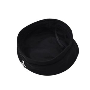 Close-up of black wool beret showing interior lining and adjustable drawstring detail