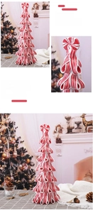 Detail of red and white candy cane tiered tower with glitter finish and mint top