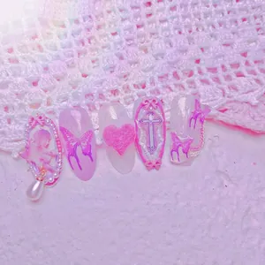 Dreamy pink purple press-on nails set with 3D bows, butterfly patterns and pearl charms