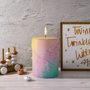 Relief flower gradient cylinder aromatherapy candle with warm flame on wood surface