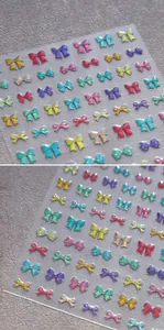 Detailed view of 3D embossed colorful bow nail art stickers with glitter laser finish