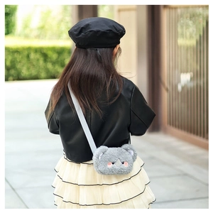 Cute gray koala plush crossbody bag styled with a fashion outfit on a young model
