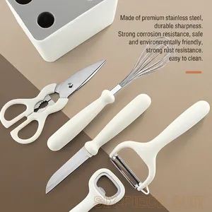 Modern 6-piece stainless steel kitchen tool set with cream white handles and storage base