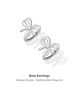 Detailed macro view of polished S925 sterling silver bow-knot hoop earrings