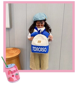 Kids color-block backpack with 3D ear details worn by a stylish child outdoors