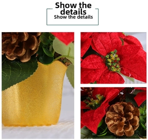 Detail of red velvet poinsettia flowers with golden pinecones in a metallic gold pot