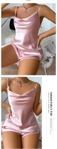 Close-up detail of smooth pink ice silk pajamas featuring a cowl neck and satin finish
