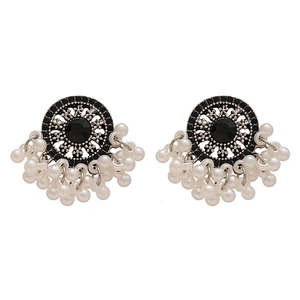 Vintage ethnic earrings with silver base, black stones, and white pearl tassel charms